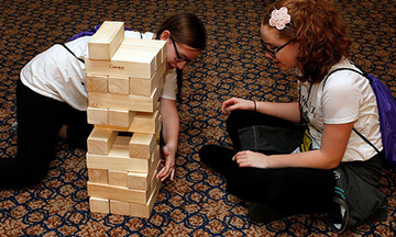 girls playing Jenga